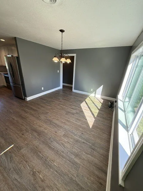 Remodeled living space with dark luxury vinyl plank