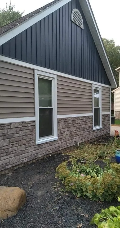Two-tone siding with stone base